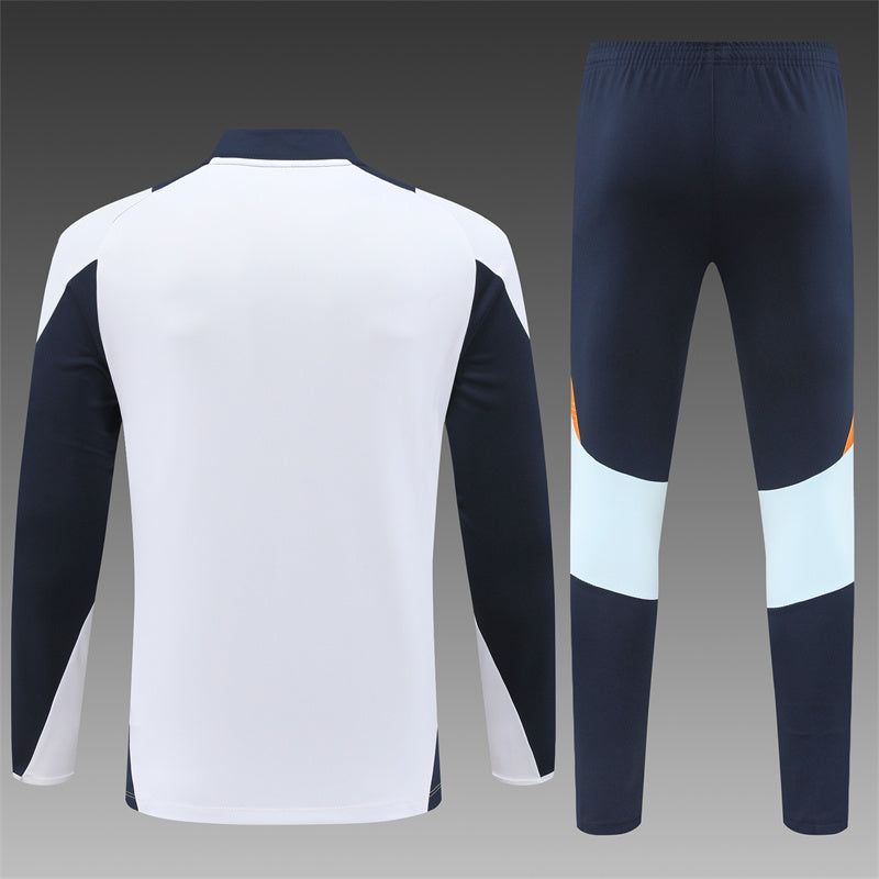 Chándal Real Madrid blanco naranja 2024/2025